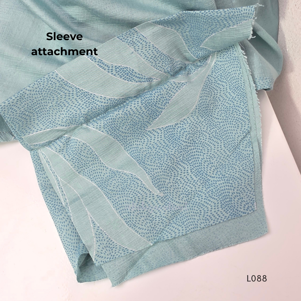 eal blue rayon blend 2-piece set with leaf line print, high neck top, back zip and matching printed straight pant.