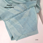 eal blue rayon blend 2-piece set with leaf line print, high neck top, back zip and matching printed straight pant.