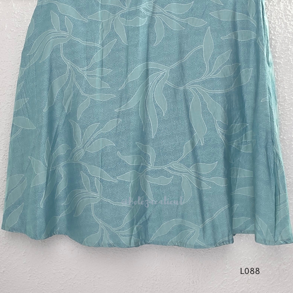 eal blue rayon blend 2-piece set with leaf line print, high neck top, back zip and matching printed straight pant.