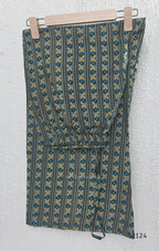 Teal green Jaipur cotton churidar set with V-neck detail, circular print, striped bottom and matching printed dupatta.