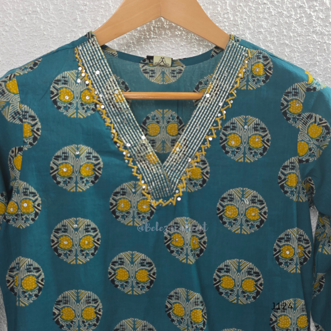 Teal green Jaipur cotton churidar set with V-neck detail, circular print, striped bottom and matching printed dupatta.