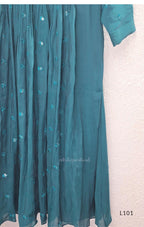 Teal mul chanderi A-line kurti with V-neck, gathered front panel, 3/4 sleeves and tonal embroidered motifs.