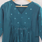 Teal mul chanderi A-line kurti with V-neck, gathered front panel, 3/4 sleeves and tonal embroidered motifs.