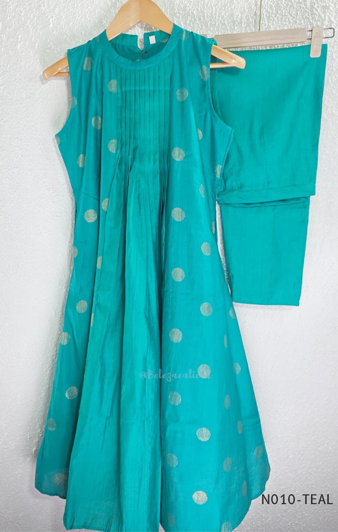 Teal Vertigan silk two-piece coord set with pleated A-line top, gold circular motifs and matching straight pants.