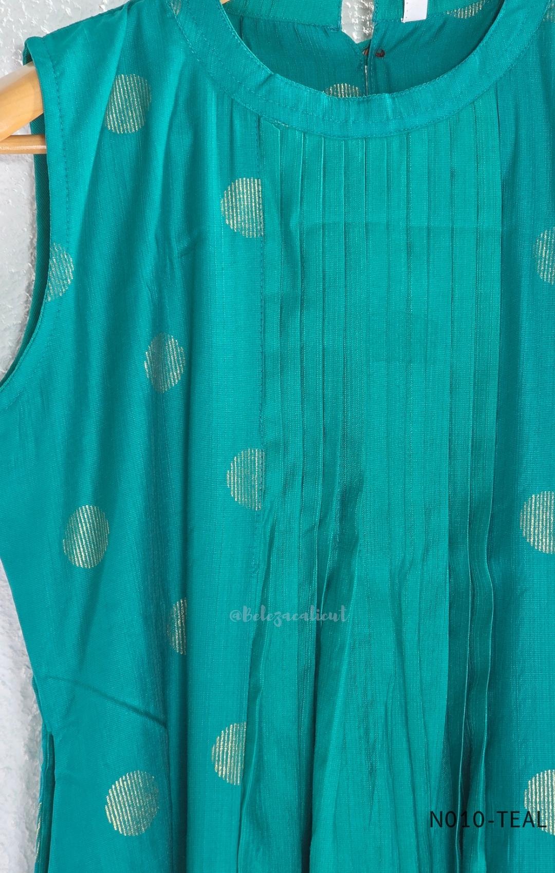 Teal Vertigan silk two-piece coord set with pleated A-line top, gold circular motifs and matching straight pants.