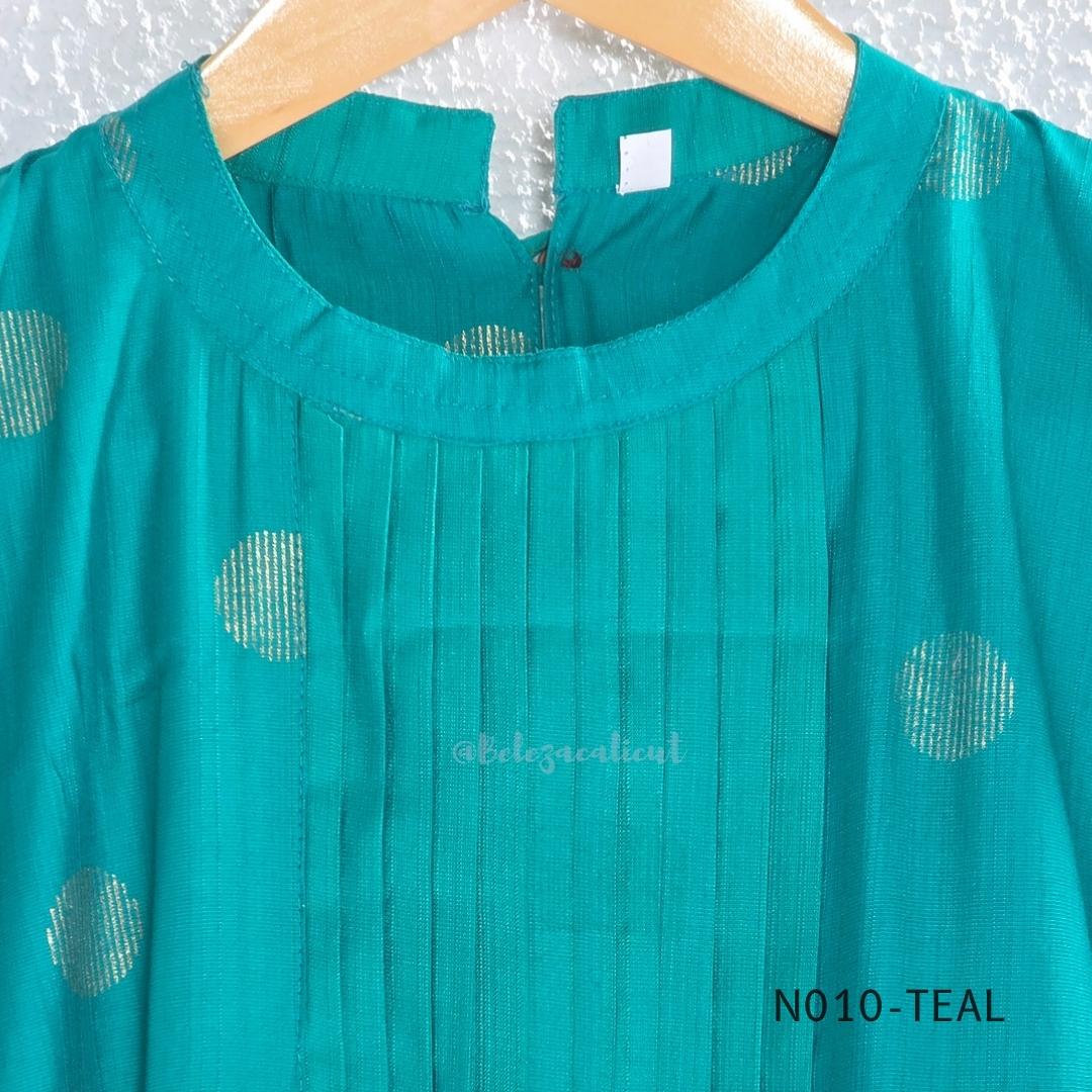 Teal Vertigan silk two-piece coord set with pleated A-line top, gold circular motifs and matching straight pants.