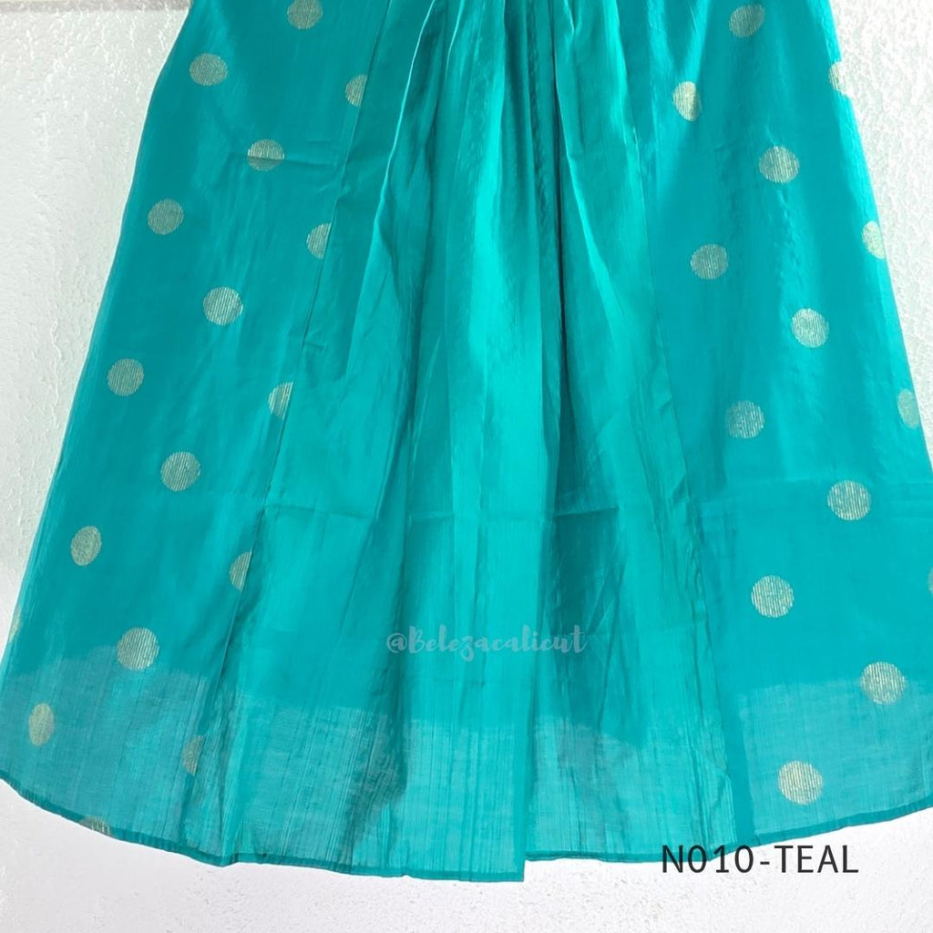 Teal Vertigan silk two-piece coord set with pleated A-line top, gold circular motifs and matching straight pants.