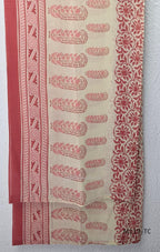 Terracotta Cotton Silk churidar set with paisley motifs, floral embroidered hem, matching straight pants and cream printed dupatta.