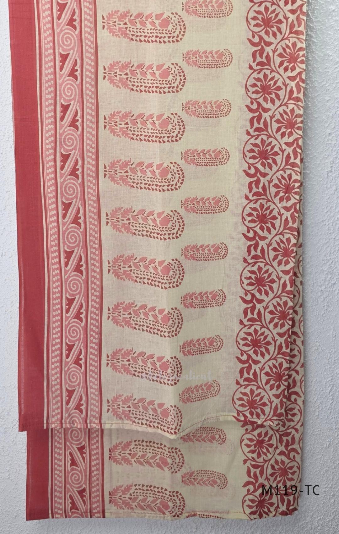 Terracotta Cotton Silk churidar set with paisley motifs, floral embroidered hem, matching straight pants and cream printed dupatta.
