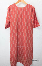 Terracotta Cotton Silk churidar set with paisley motifs, floral embroidered hem, matching straight pants and cream printed dupatta.