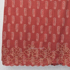 Terracotta Cotton Silk churidar set with paisley motifs, floral embroidered hem, matching straight pants and cream printed dupatta.