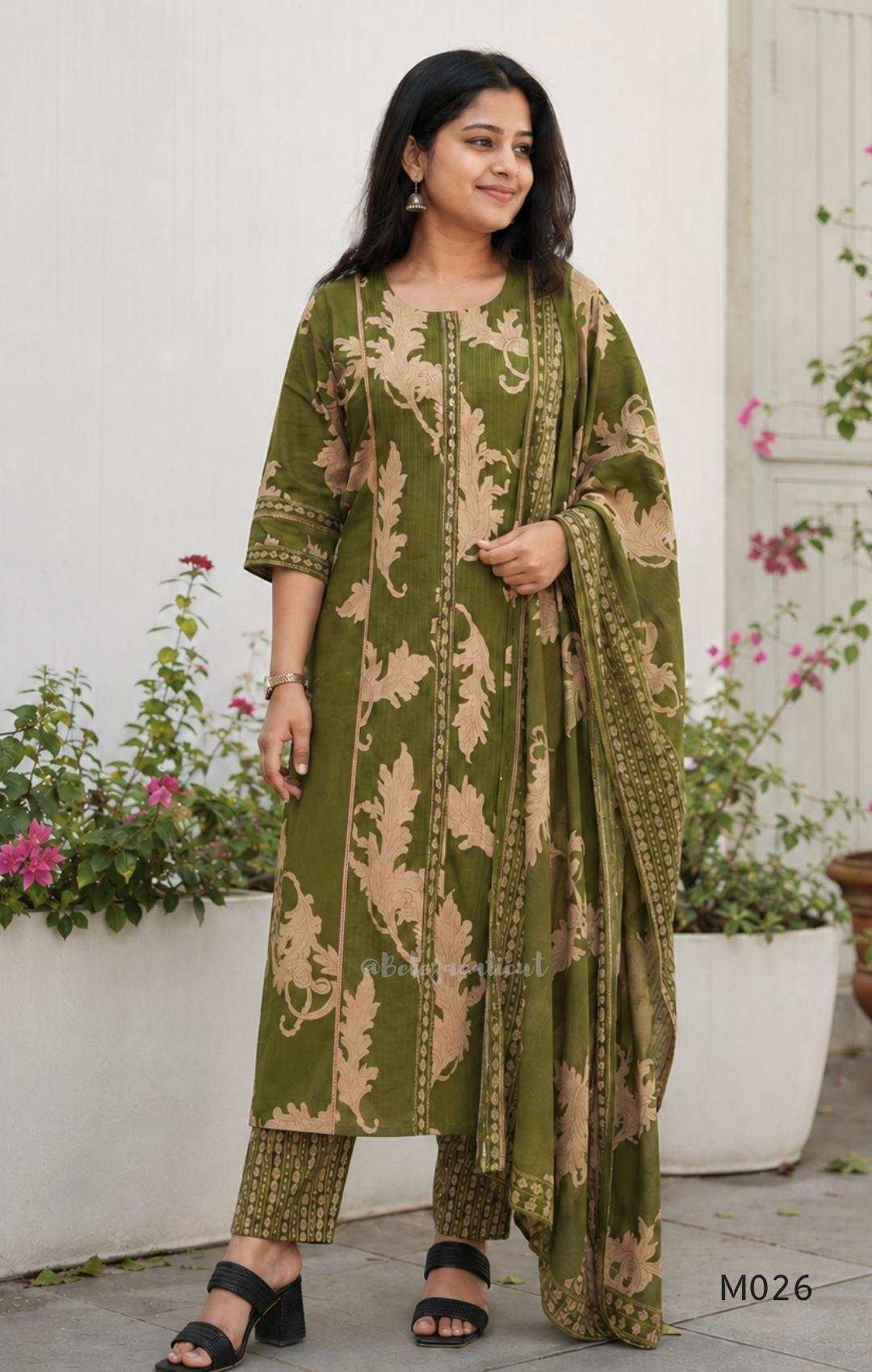 Olive green cotton 3-piece ethnic set with beige leaf print kurta, matching printed pant and dupatta.