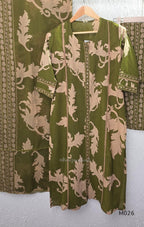 Olive green cotton 3-piece ethnic set with beige leaf print kurta, matching printed pant and dupatta.