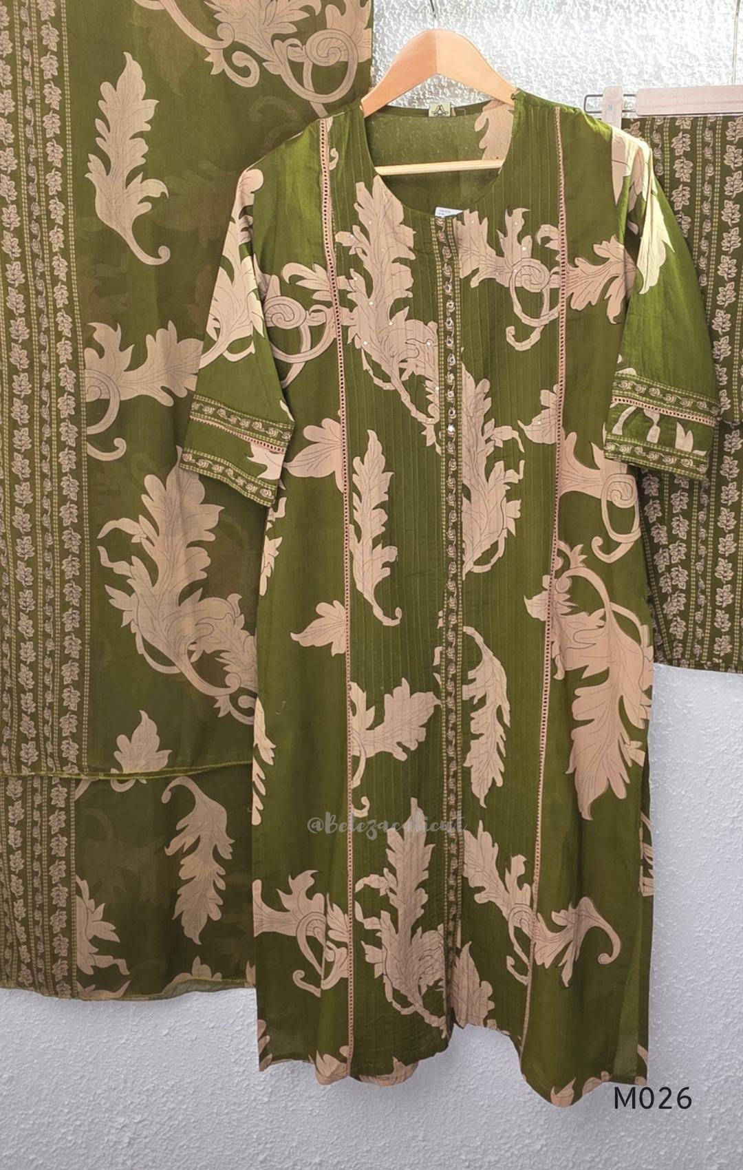 Olive green cotton 3-piece ethnic set with beige leaf print kurta, matching printed pant and dupatta.
