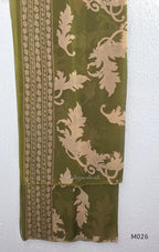 Olive green cotton 3-piece ethnic set with beige leaf print kurta, matching printed pant and dupatta.