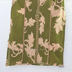 Olive green cotton 3-piece ethnic set with beige leaf print kurta, matching printed pant and dupatta.