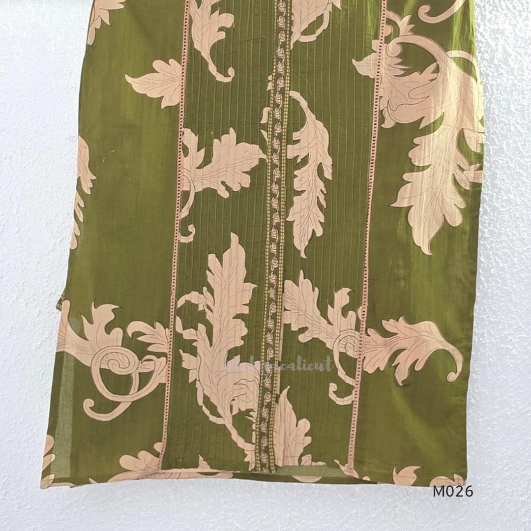 Olive green cotton 3-piece ethnic set with beige leaf print kurta, matching printed pant and dupatta.