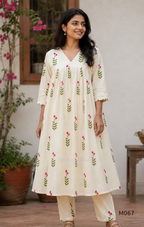 Warm ivory cotton lined 2-piece set with green stem and rose-pink blossom print, V-neckline, gathered front yoke and matching bottom.