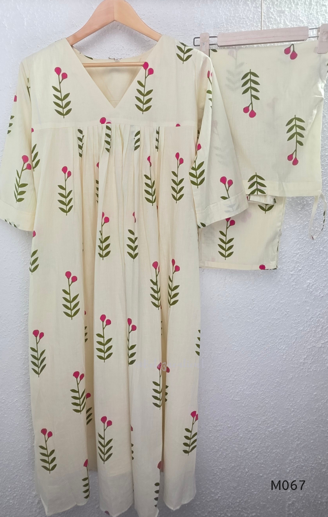 Warm ivory cotton lined 2-piece set with green stem and rose-pink blossom print, V-neckline, gathered front yoke and matching bottom.