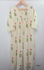 Warm ivory cotton lined 2-piece set with green stem and rose-pink blossom print, V-neckline, gathered front yoke and matching bottom.