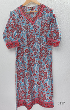 White ivory cotton 3-piece churidar set with dense red and blue kalamkari-style block print, gold sequin V-neckline, lace cuff, and printed dupatta with bold red border.