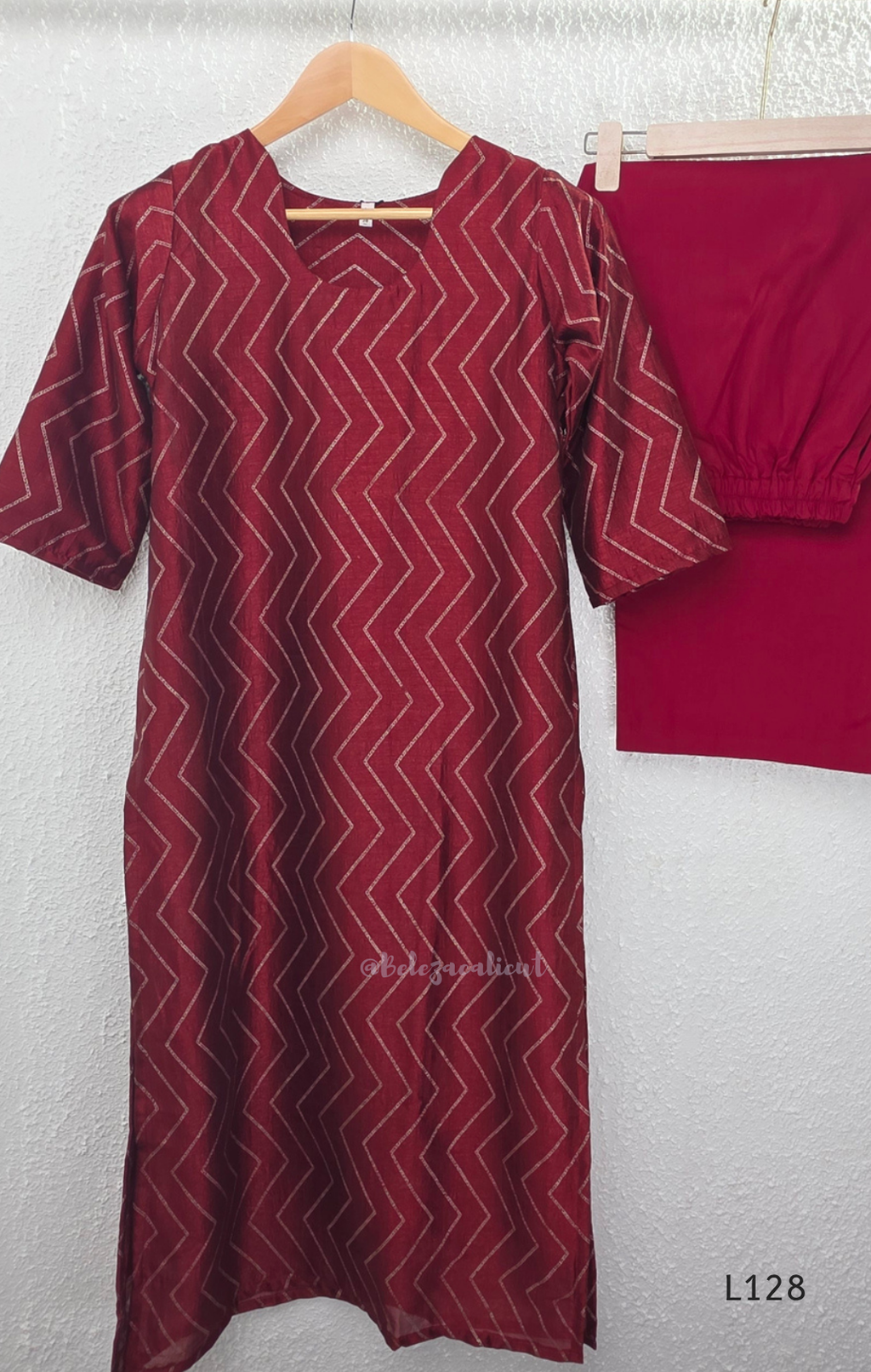 Wine maroon soft silk blend 2-piece kurti set with beige silver chevron line print, short sleeves, V neckline and matching plain bottom.