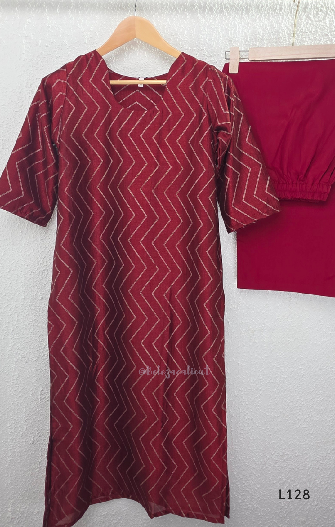 Wine maroon soft silk blend 2-piece kurti set with beige silver chevron line print, short sleeves, V neckline and matching plain bottom.