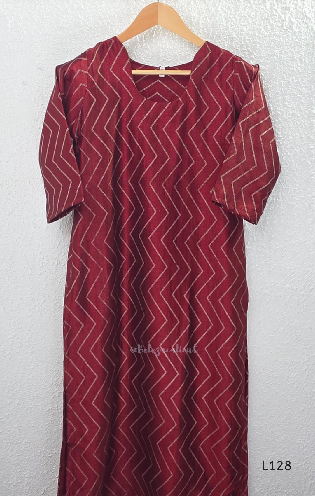 Wine maroon soft silk blend 2-piece kurti set with beige silver chevron line print, short sleeves, V neckline and matching plain bottom.