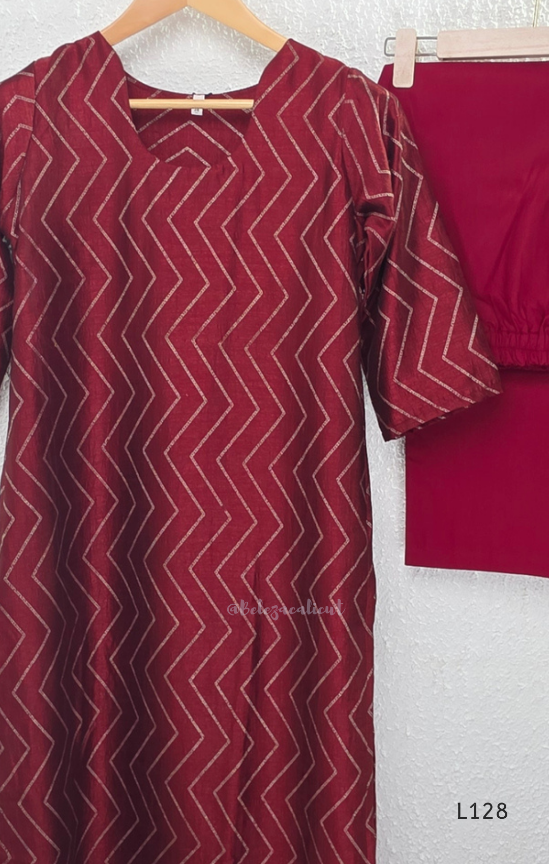 Wine maroon soft silk blend 2-piece kurti set with beige silver chevron line print, short sleeves, V neckline and matching plain bottom.
