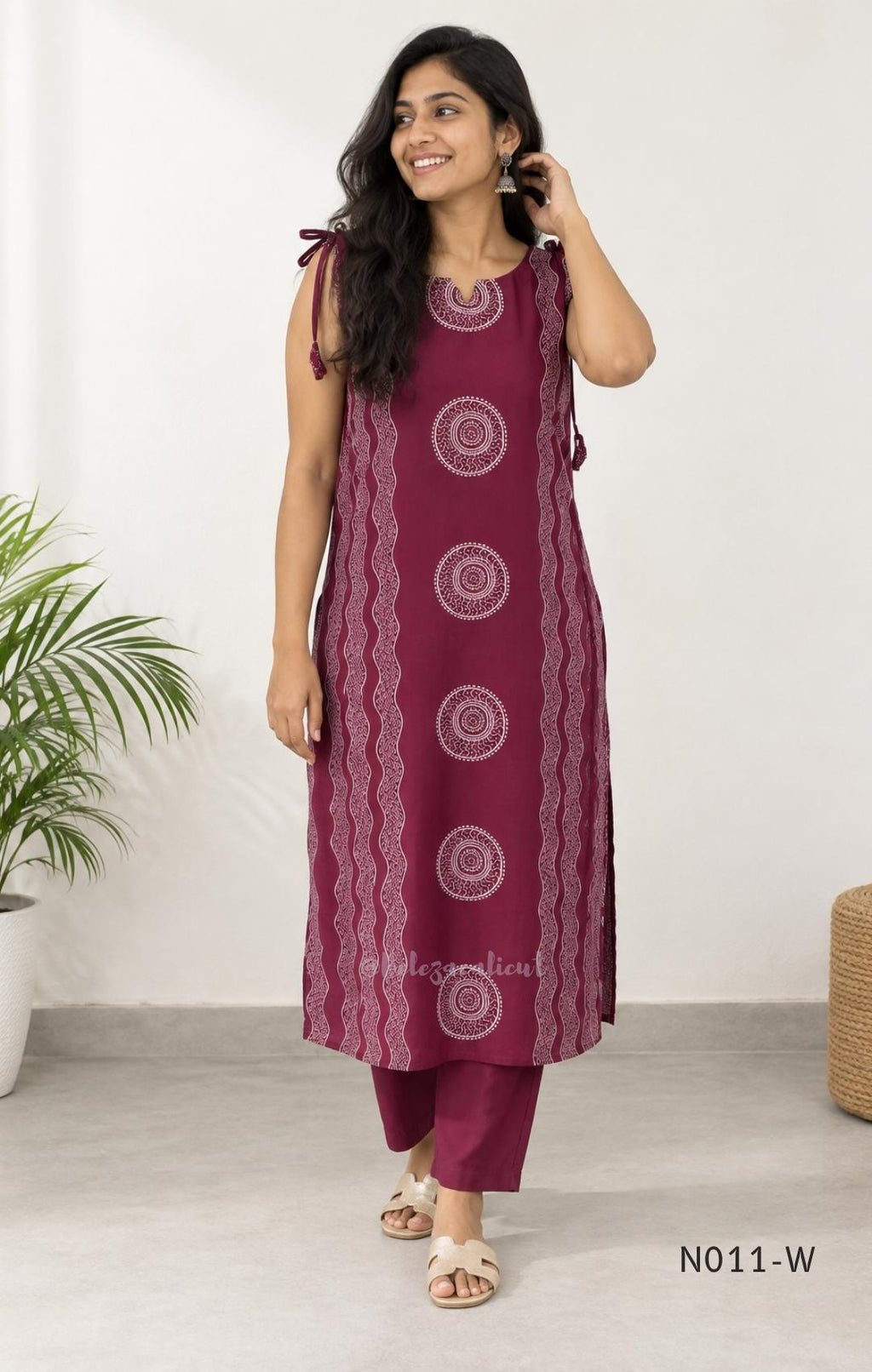 Wine Vertigan silk printed coord set with sleeveless shoulder-tie top and matching straight pants.