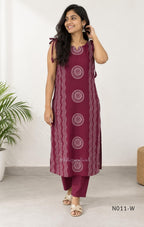 Wine Vertigan silk printed coord set with sleeveless shoulder-tie top and matching straight pants.