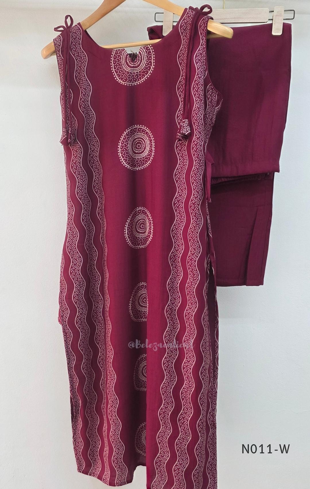  Wine Vertigan silk printed coord set with sleeveless shoulder-tie top and matching straight pants.