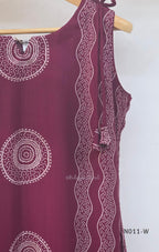  Wine Vertigan silk printed coord set with sleeveless shoulder-tie top and matching straight pants.
