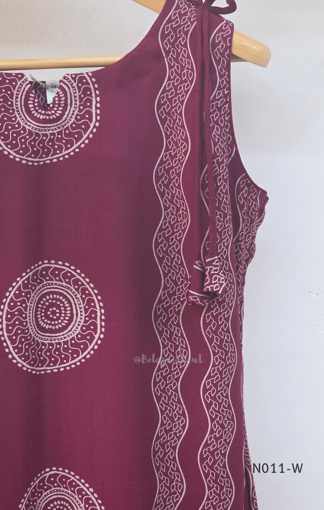  Wine Vertigan silk printed coord set with sleeveless shoulder-tie top and matching straight pants.