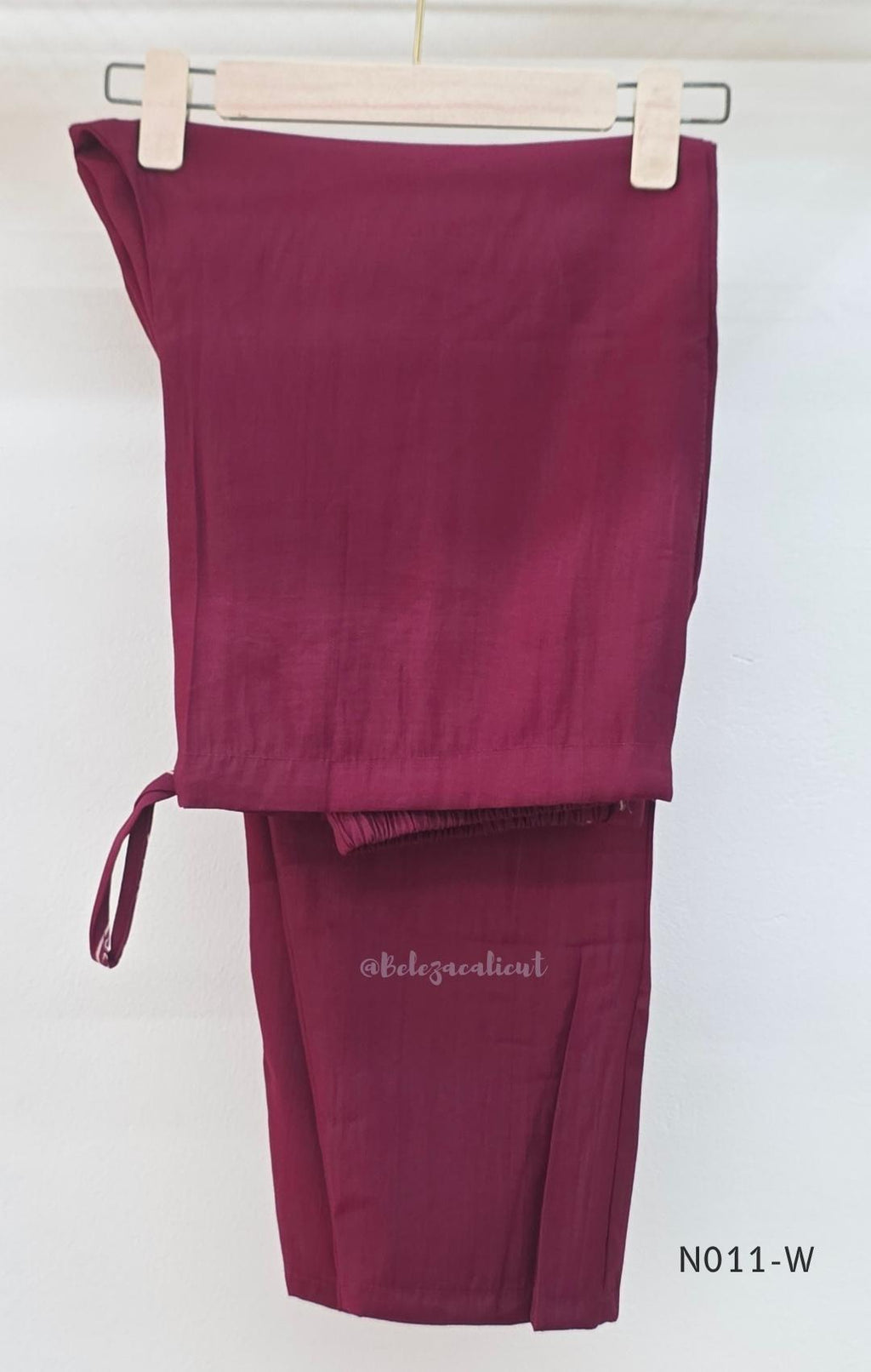  Wine Vertigan silk printed coord set with sleeveless shoulder-tie top and matching straight pants.