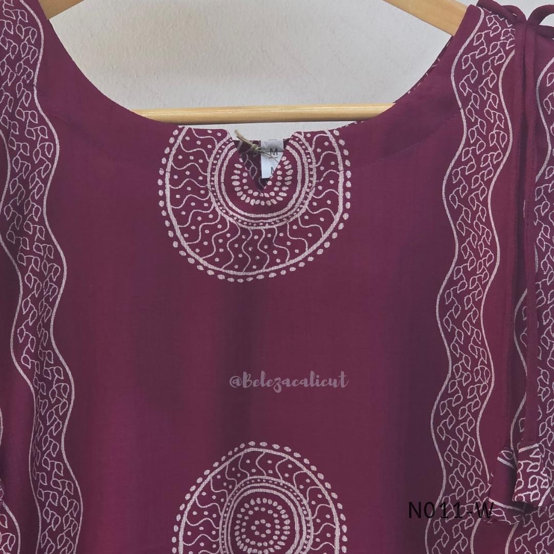  Wine Vertigan silk printed coord set with sleeveless shoulder-tie top and matching straight pants.