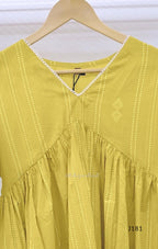 Yellow-green cotton short top with vertical dotted design, gathered flared yoke and bell sleeves.