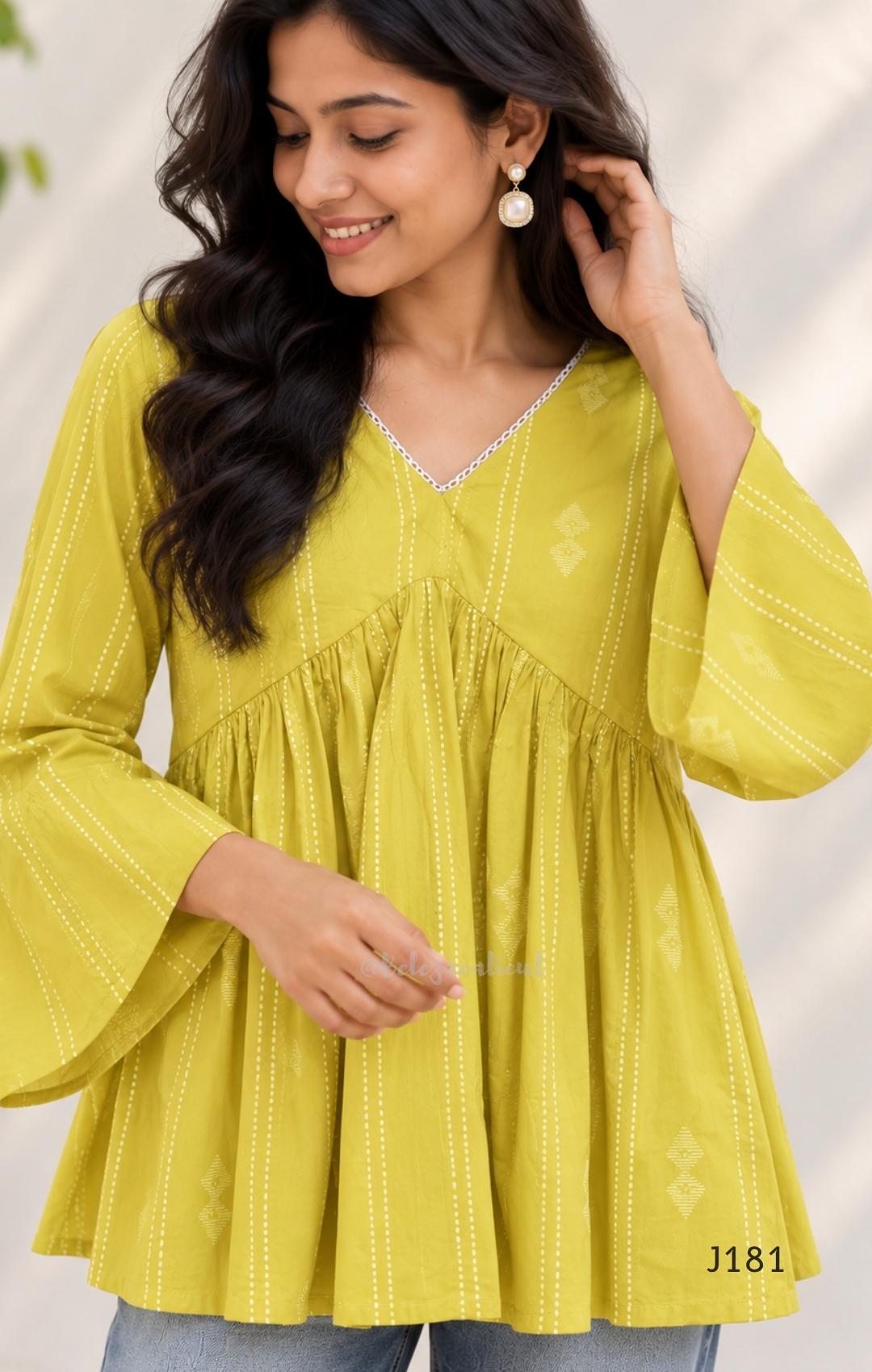 Yellow-green cotton short top with vertical dotted design, gathered flared yoke and bell sleeves.