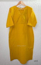Yellow cotton lined 3-piece ethnic set with V-neck pintuck yoke, matching straight pant and textured tassel dupatta.