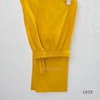 Yellow cotton lined 3-piece ethnic set with V-neck pintuck yoke, matching straight pant and textured tassel dupatta.