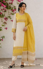 Yellow and cream tissue blend churidar set with woven gold-toned borders, scattered motifs, straight pants and matching dupatta.