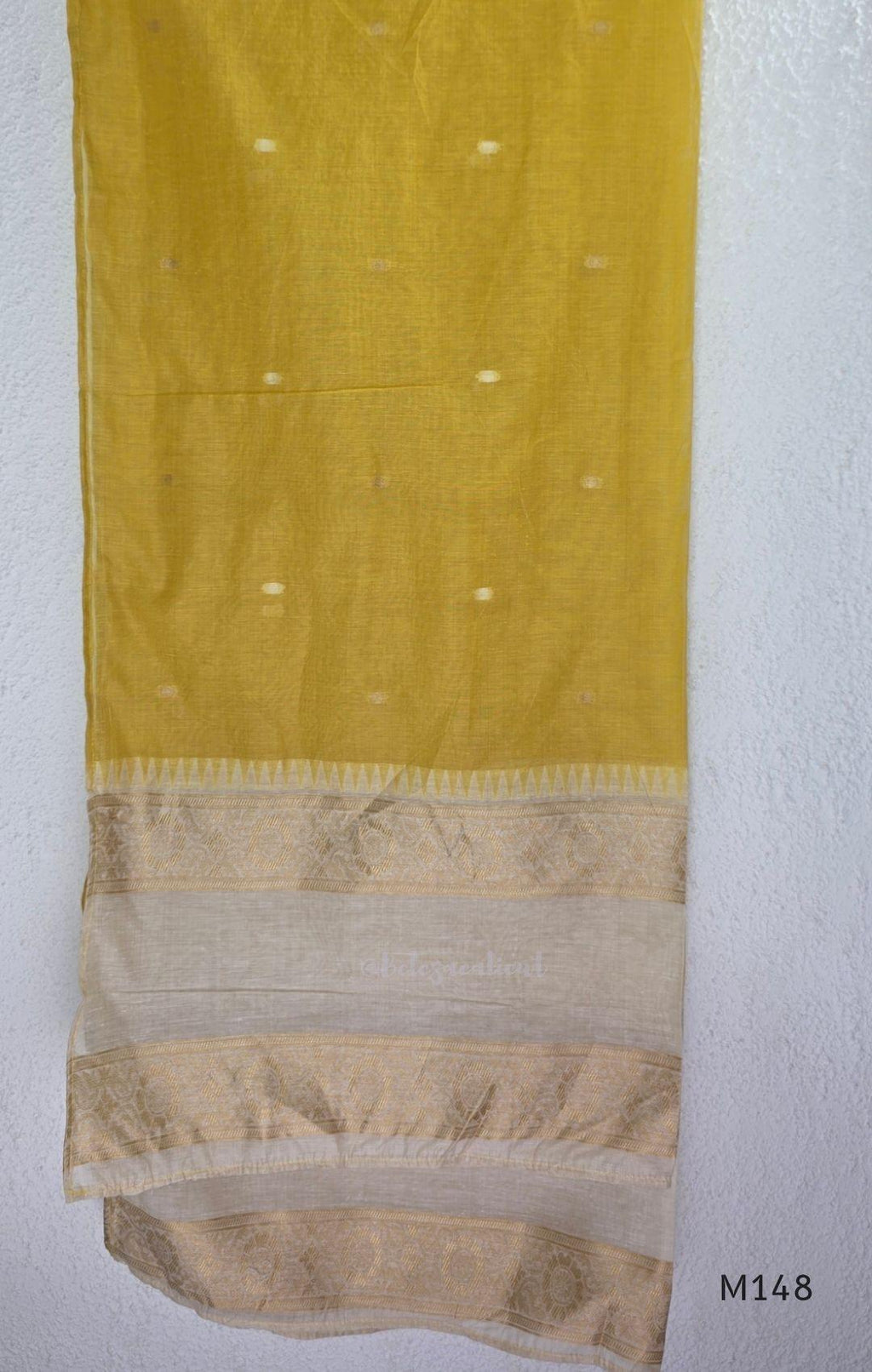 Yellow and cream tissue blend churidar set with woven gold-toned borders, scattered motifs, straight pants and matching dupatta.
