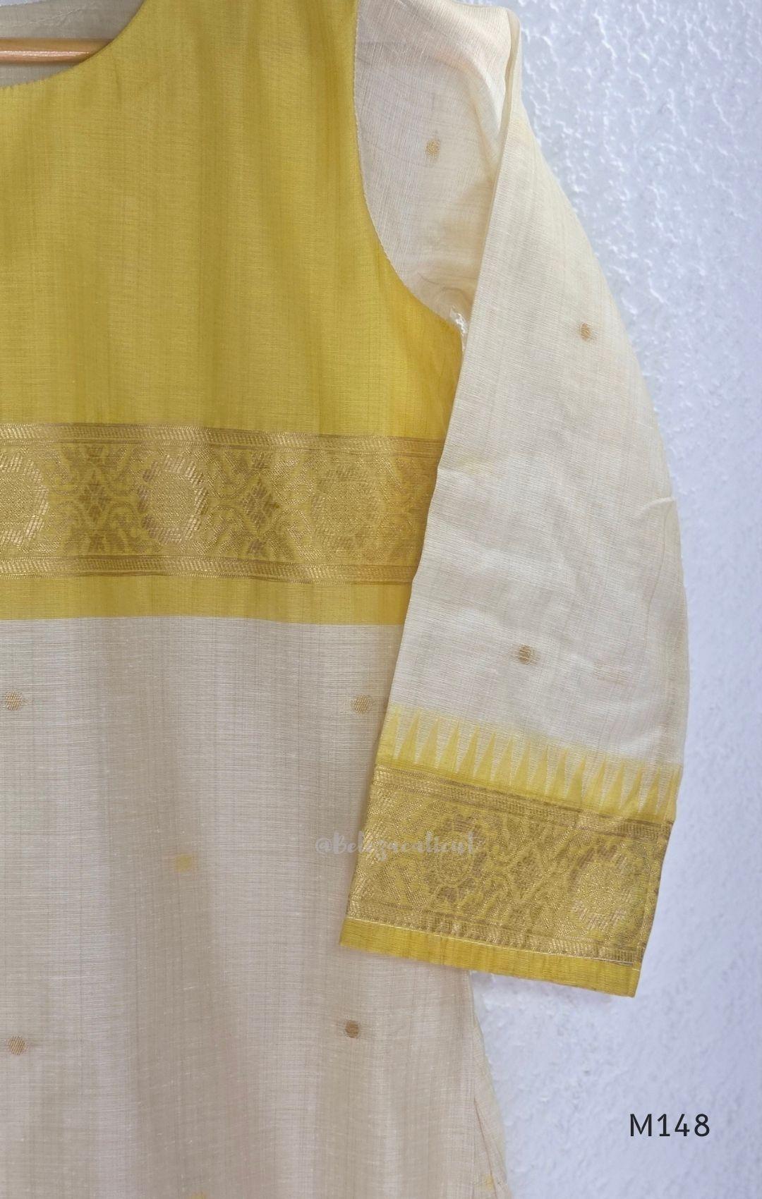 Yellow and cream tissue blend churidar set with woven gold-toned borders, scattered motifs, straight pants and matching dupatta.
