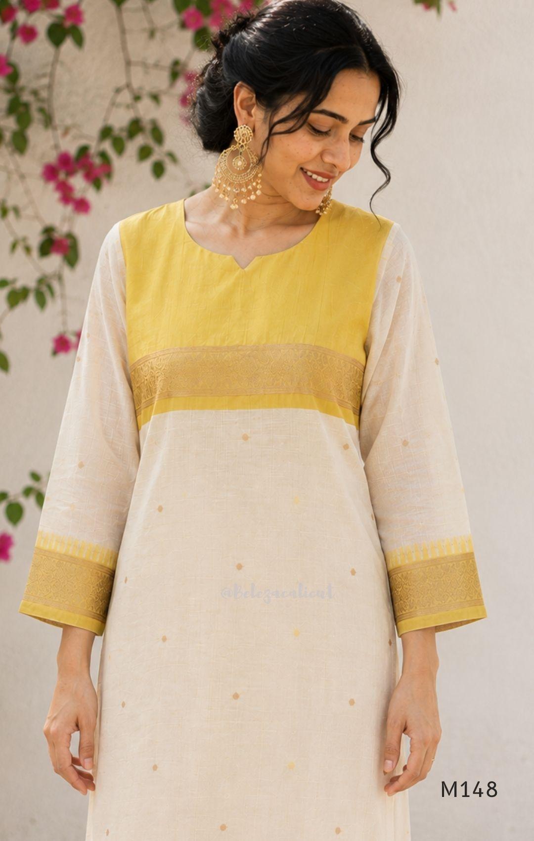 Yellow and cream tissue blend churidar set with woven gold-toned borders, scattered motifs, straight pants and matching dupatta.