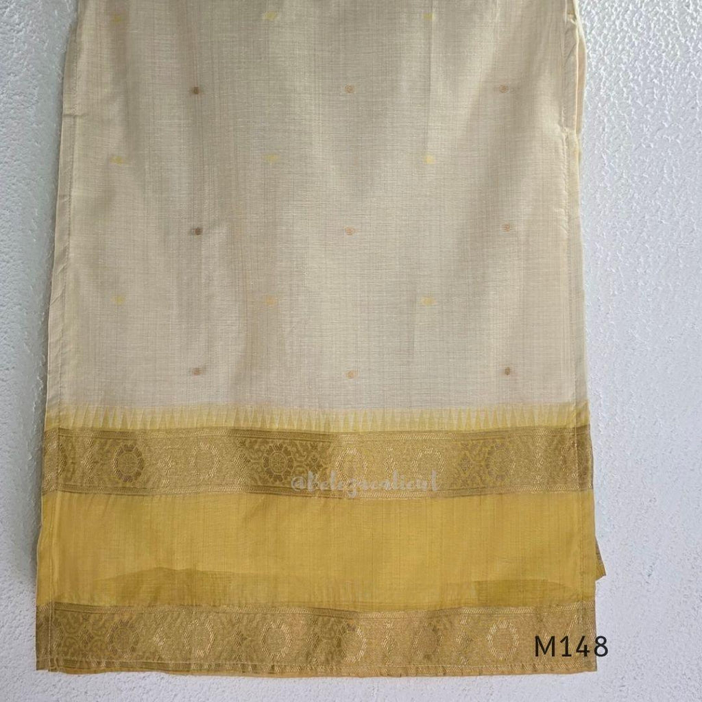 Yellow and cream tissue blend churidar set with woven gold-toned borders, scattered motifs, straight pants and matching dupatta.