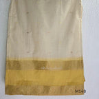 Yellow and cream tissue blend churidar set with woven gold-toned borders, scattered motifs, straight pants and matching dupatta.