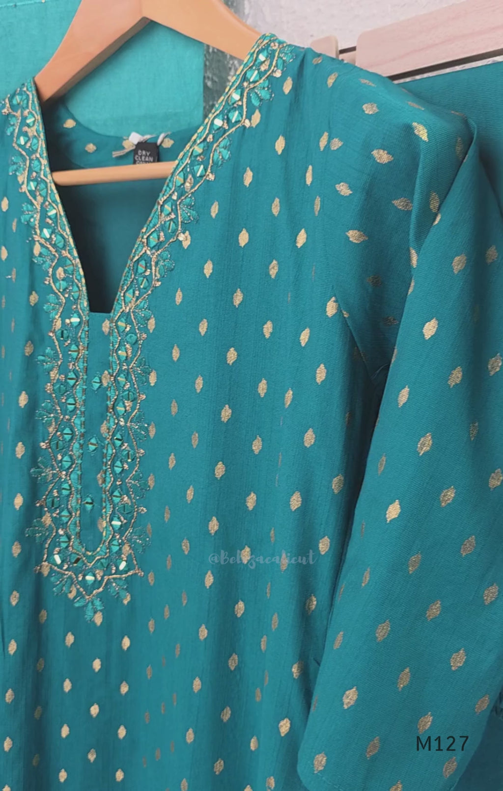 Peacock teal silk blend 3-piece churidar set with gold buti motifs, decorated V-neckline, plain matching bottom and gold-bordered dupatta.