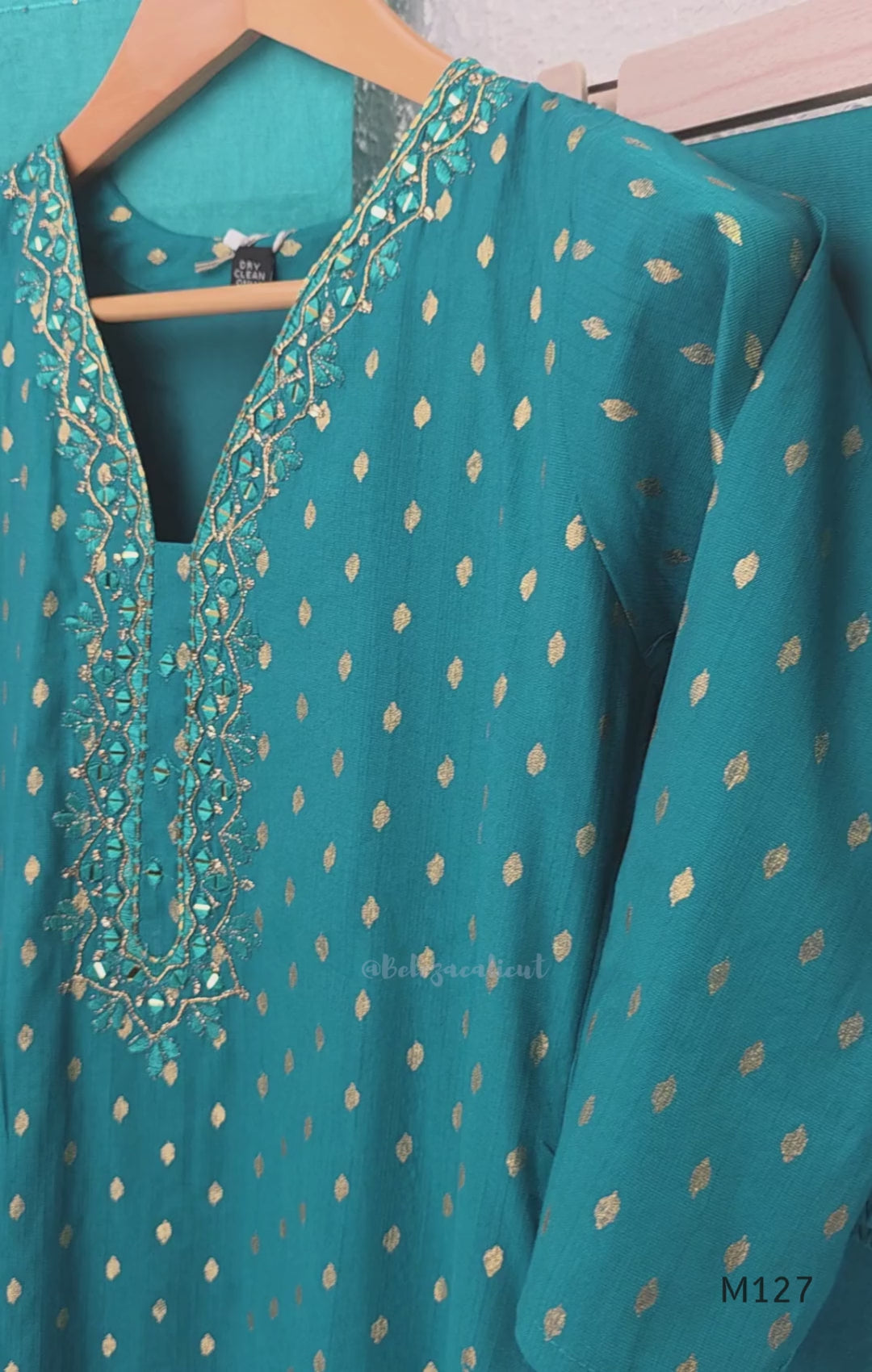 Peacock teal silk blend 3-piece churidar set with gold buti motifs, decorated V-neckline, plain matching bottom and gold-bordered dupatta.