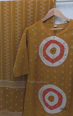 Mustard cotton 3-piece churidar set with abstract circle print kurta, matching printed dupatta and ankle-cuff bottom.
