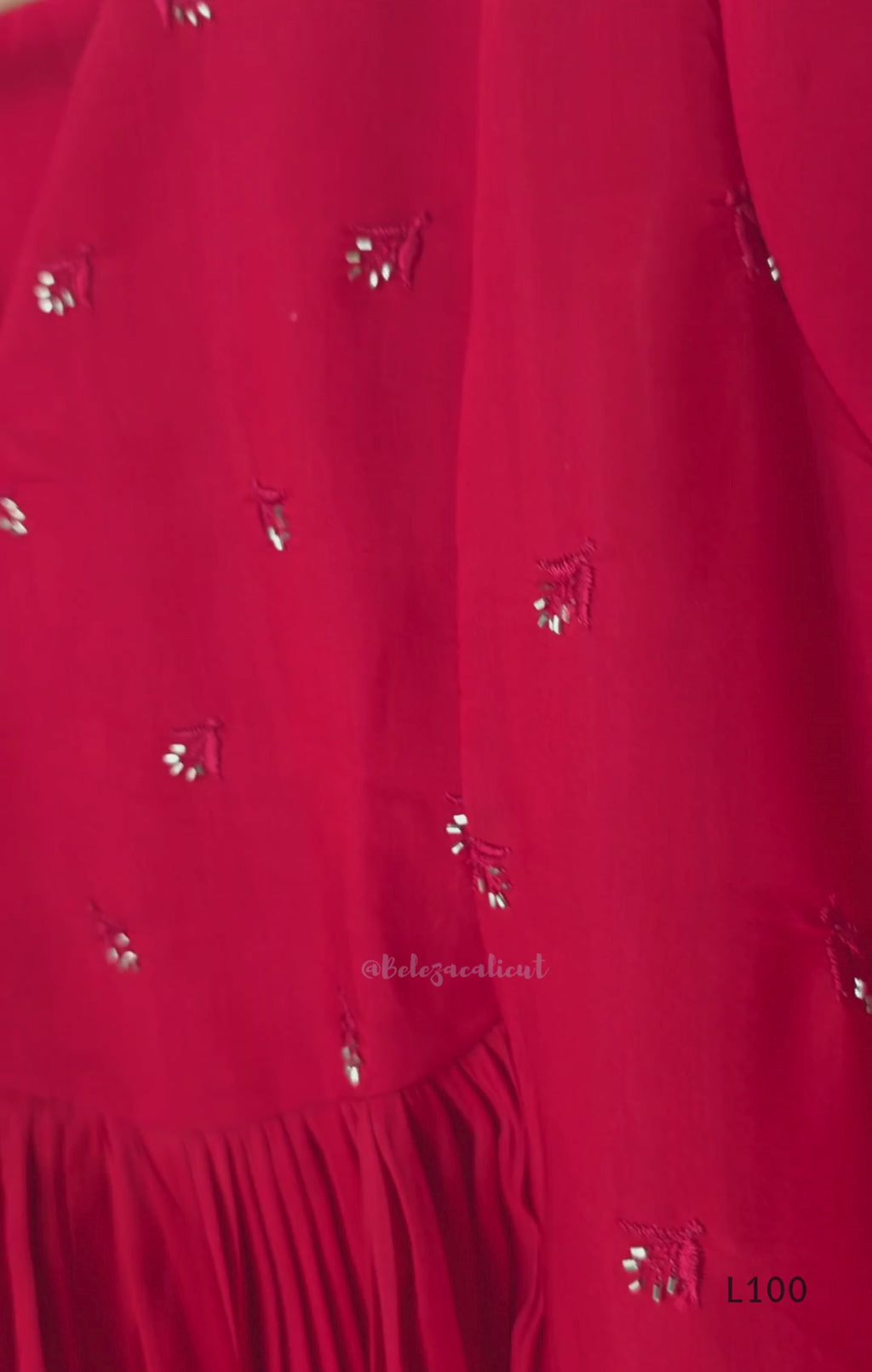 Red mul chanderi A-line kurti with V-neck, gathered front panel, 3/4 sleeves and small scattered embroidery.